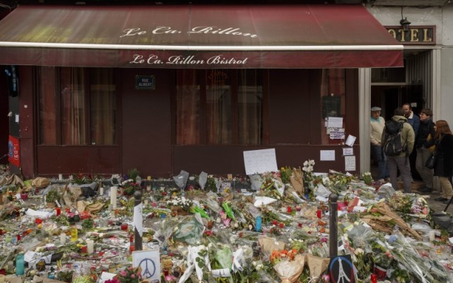 Flowers lay outside the Carillon cafe, a site of last Friday's attacks in Paris